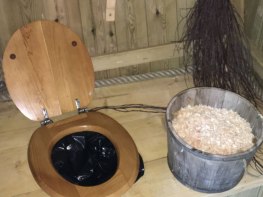 eco/dry toilet in tree house (plastic bag with sawdust on the side)