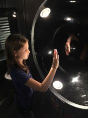 Lucy reaches out to her hand's reflection, Camera Obscura Museum